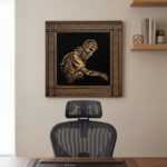 palestinian artwork in a framed wood wall art piece above a mesh office chair