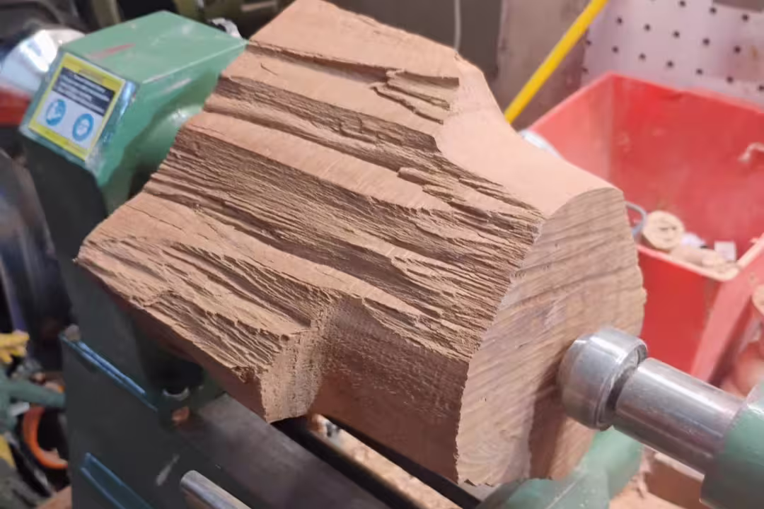 Rough-cut madrone wood on lathe