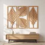 Three-panel palm leaf laser cut wood wall art in natural brown matte finish