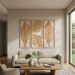 Handcrafted three-panel wood wall art with carved tropical leaf designs above a modern sofa