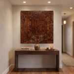 Handcrafted wood wall art featuring an intricate maze pattern, enhancing modern decor in a stylish hallway setting.
