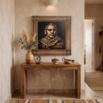 Wood wall art portrait above a wooden console table in a warm hallway interior