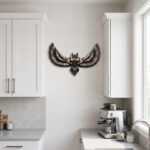 Bird wall art depicting a soaring owl with spread wings in a bright modern kitchen