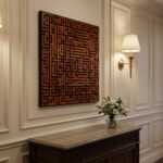 Islamic wall art with geometric Kufic calligraphy above a carved console in an elegant hallway